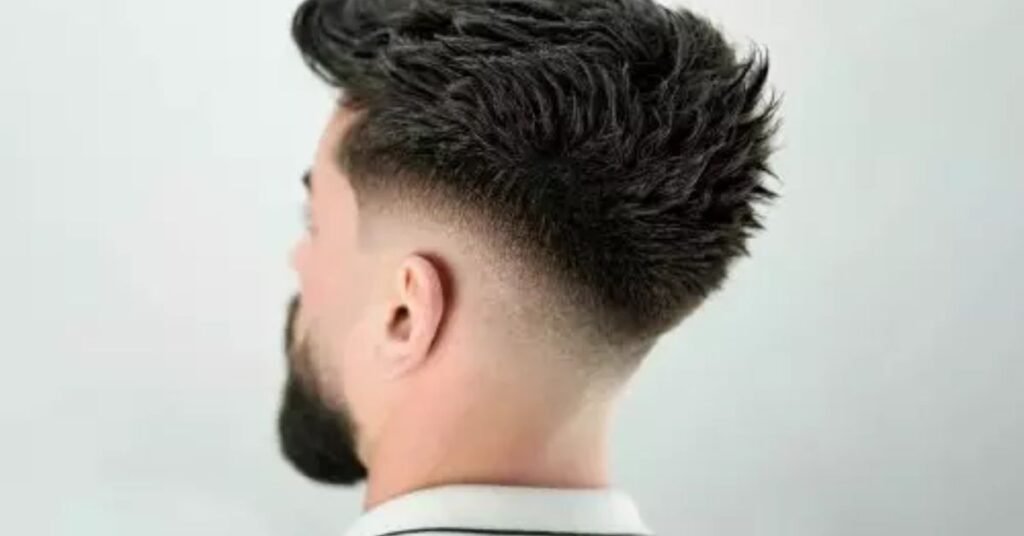 mid fade haircut for Black men with textured top